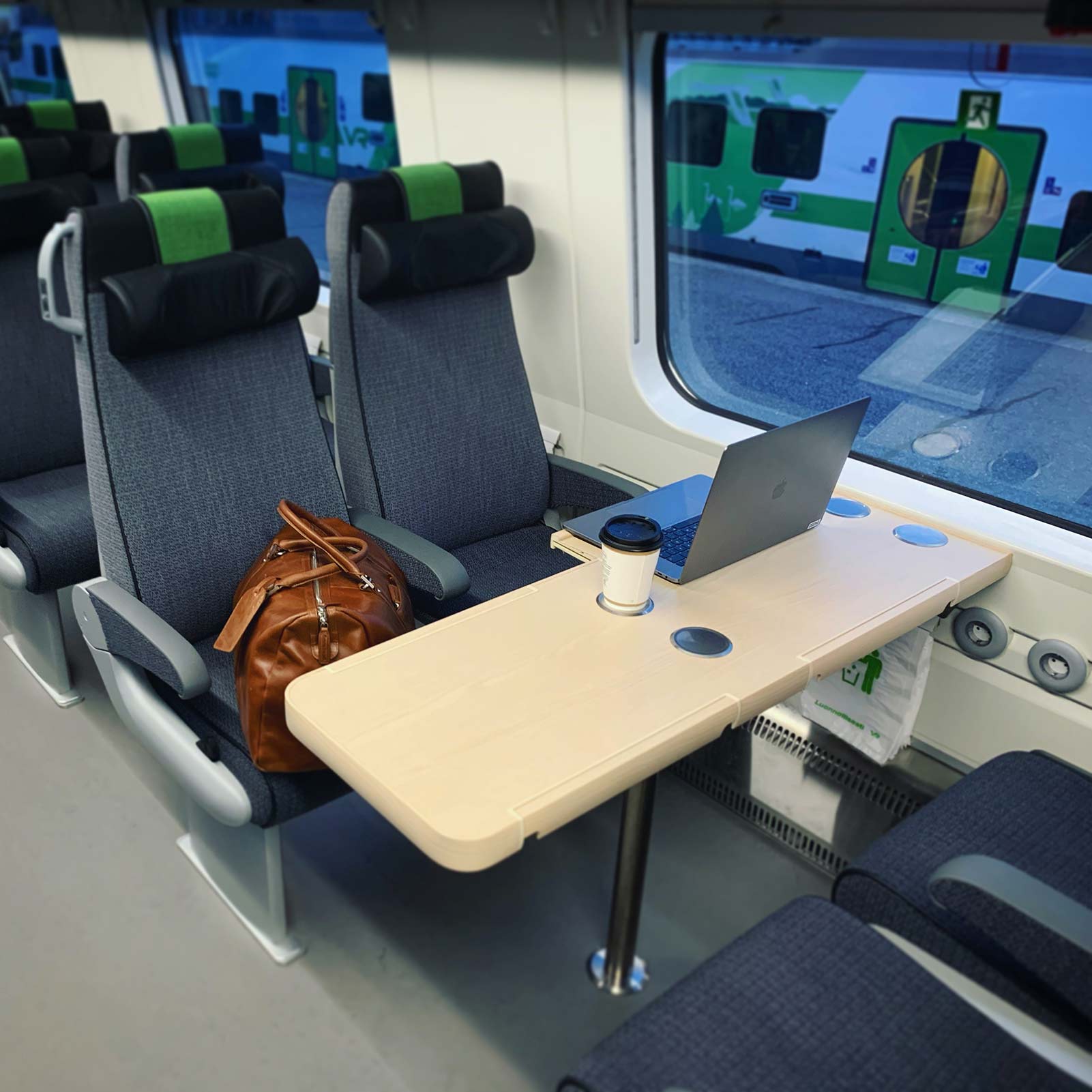 Photo from a train with a laptop on a table